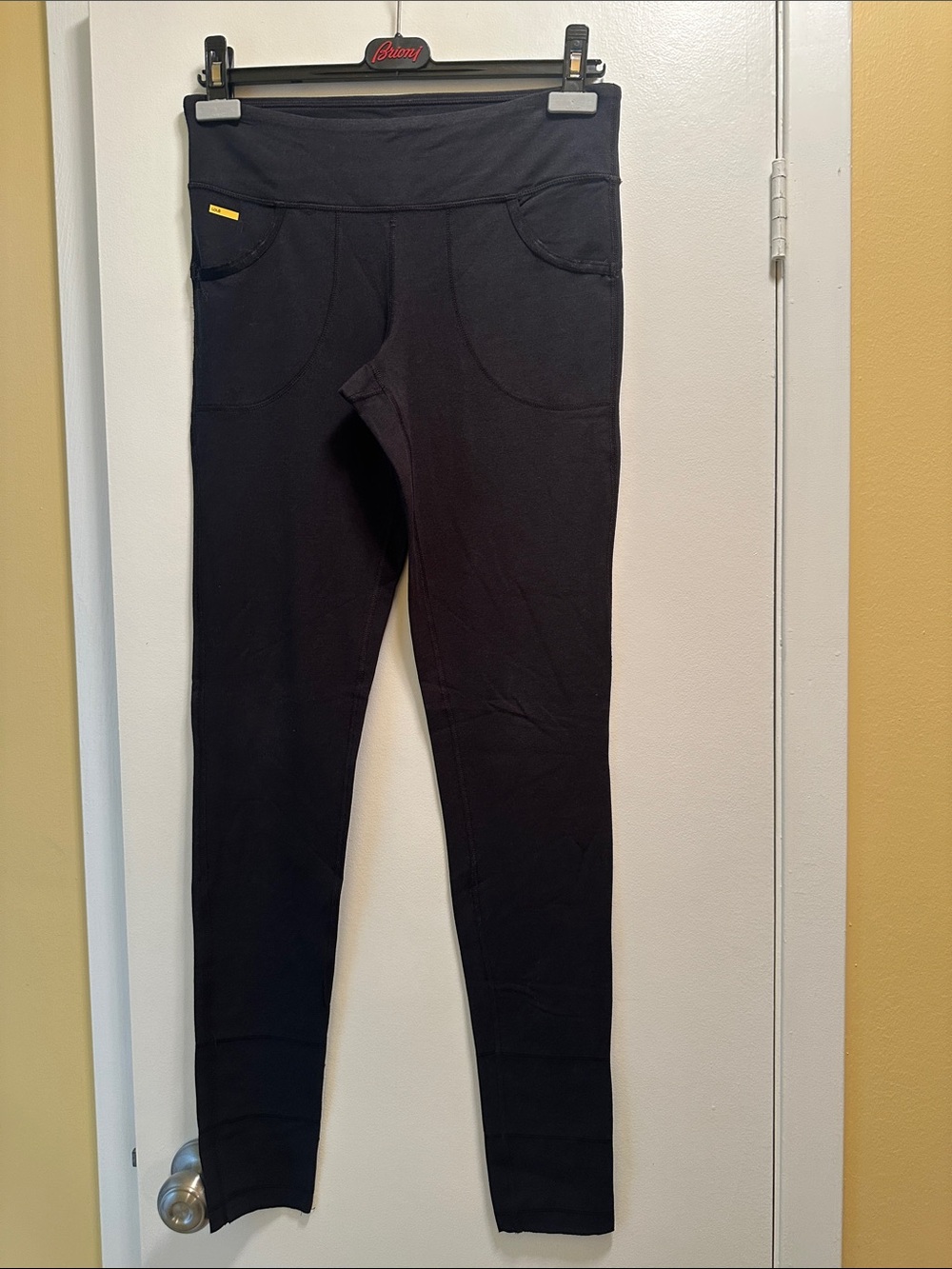 Lole Black Leggings with Twin Front Pockets and serged seam detail in calf area